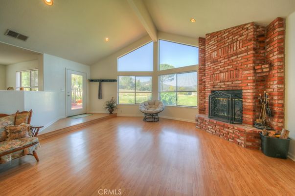 Empty room, Fireplace, Interior, Recessed Lighting, Stone Walls, Wood Texture Flooring