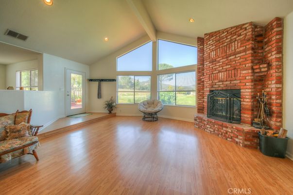 Empty room, Fireplace, Interior, Recessed Lighting, Stone Walls, Wood Texture Flooring