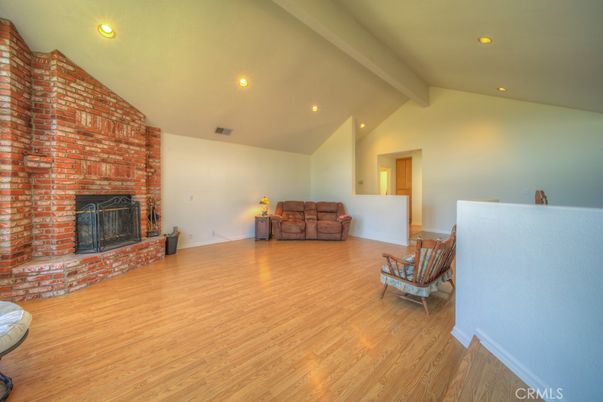 Empty room, Fireplace, Interior, Recessed Lighting, Stone Walls, Wood Texture Flooring