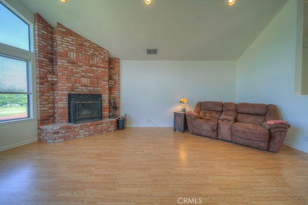 Empty room, Fireplace, Interior, Recessed Lighting, Stone Walls, Wood Texture Flooring