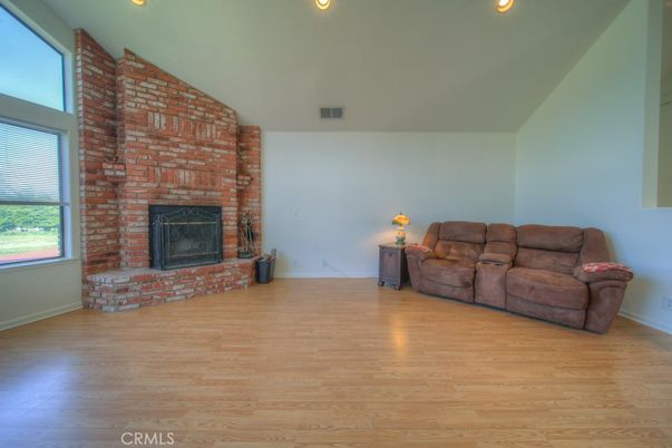 Empty room, Fireplace, Interior, Recessed Lighting, Stone Walls, Wood Texture Flooring