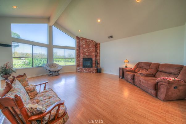 Fireplace, Interior, Living room, Recessed Lighting, Stone Walls, Wood Texture Flooring