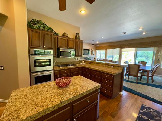 Dining room, Interior, Kitchen, Recessed Lighting, Stainless Steel Appliances, Wood Texture Flooring