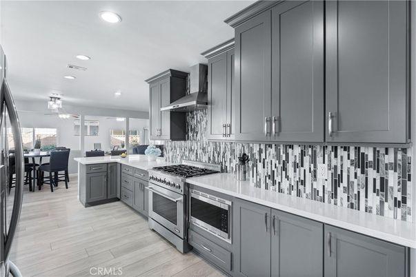 Dining room, Interior, Kitchen, Recessed Lighting, Stainless Steel Appliances, Wood Texture Flooring