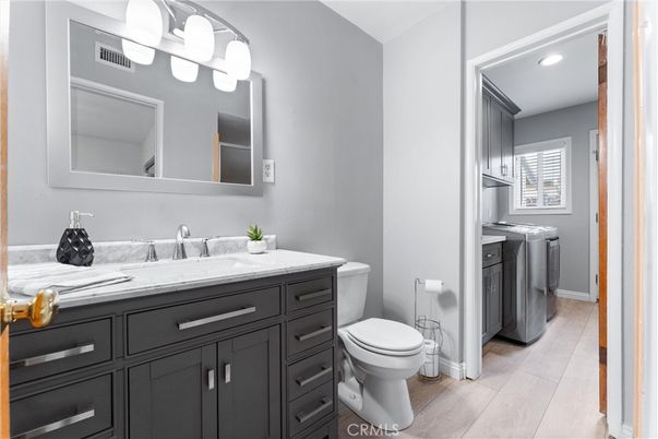 Bathroom, Interior, Recessed Lighting, Washer, Wood Texture Flooring