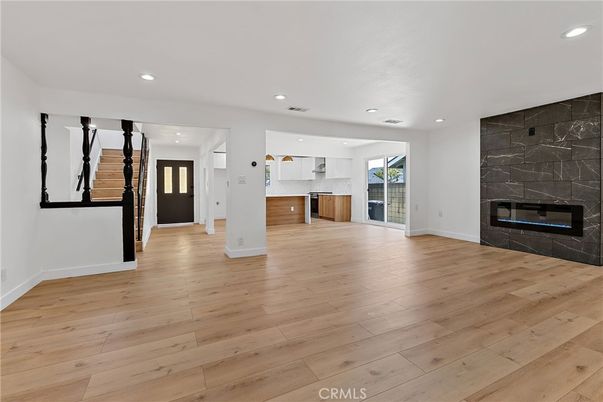 Empty room, Fireplace, Interior, Kitchen, Recessed Lighting, Wood Texture Flooring