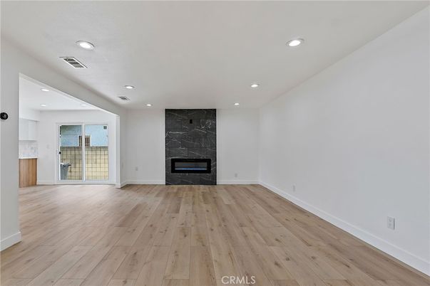 Empty room, Fireplace, Interior, Recessed Lighting, Wood Texture Flooring