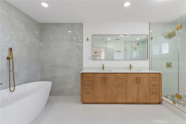 Bathroom, Dual Sink Vanities, Free Standing Baths, Glass Shower, Interior, Marble Walls, Recessed Lighting
