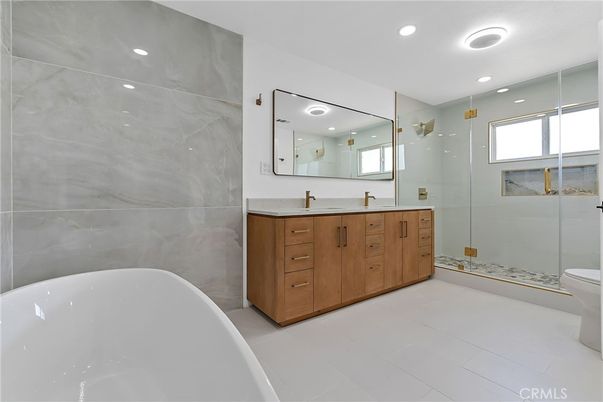 Bathroom, Dual Sink Vanities, Free Standing Baths, Glass Shower, Interior, Marble Walls, Recessed Lighting