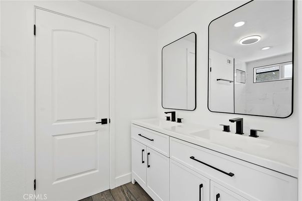 Bathroom, Dual Sink Vanities, Interior, Recessed Lighting, Wood Texture Flooring