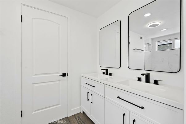 Bathroom, Dual Sink Vanities, Interior, Recessed Lighting, Wood Texture Flooring