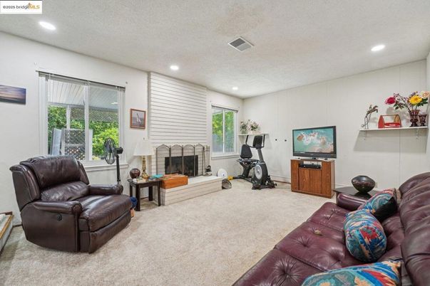 Fireplace, Fitness Equipment, Interior, Living room, Recessed Lighting