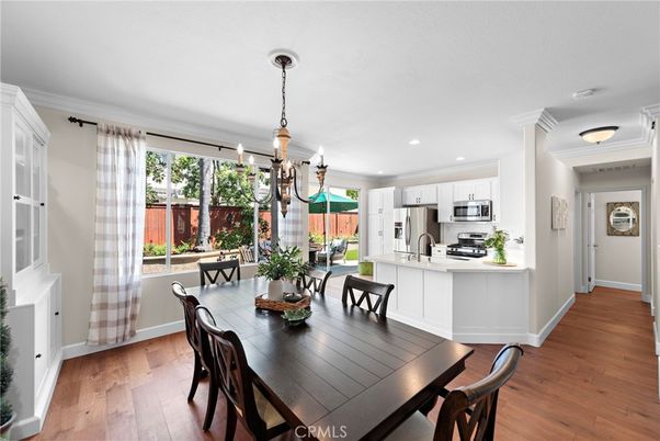 Chandelier, Dining room, Interior, Kitchen, Pendant Lights, Recessed Lighting, Stainless Steel Appliances, Wood Texture Flooring