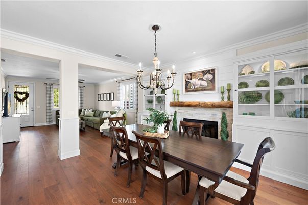 Chandelier, Dining room, Fireplace, Interior, Living room, Recessed Lighting, Wood Texture Flooring