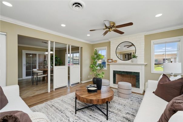 Dining room, Fireplace, Interior, Living room, Recessed Lighting, Stone Walls, Wood Texture Flooring