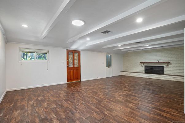 Empty room, Fireplace, Interior, Recessed Lighting, Stone Walls, Wood Texture Flooring