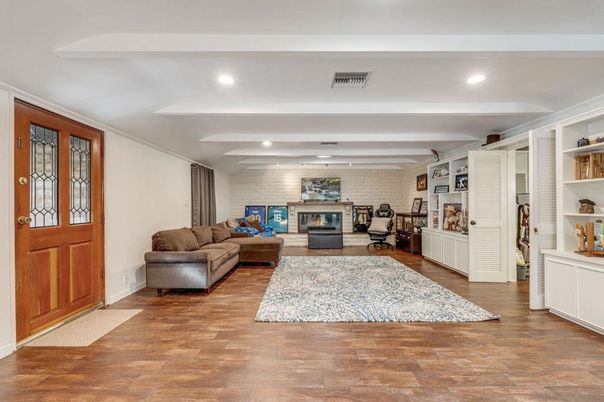 Fireplace, Interior, Living room, Recessed Lighting, Stone Walls, Wood Texture Flooring