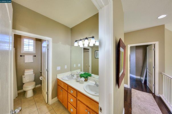 Bathroom, Dual Sink Vanities, Interior, Recessed Lighting, Wood Texture Flooring