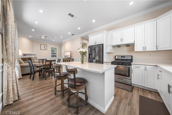 Dining room, Interior, Kitchen, Recessed Lighting, Stainless Steel Appliances, Wood Texture Flooring