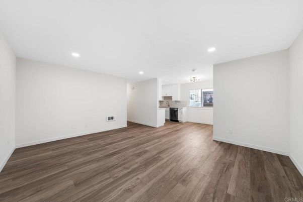Chandelier, Empty room, Interior, Kitchen, Recessed Lighting, Stainless Steel Appliances, Wood Texture Flooring