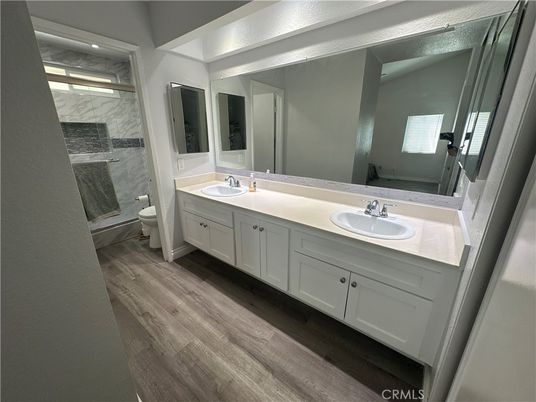 Bathroom, Dual Sink Vanities, Interior, Marble Walls, Wood Texture Flooring