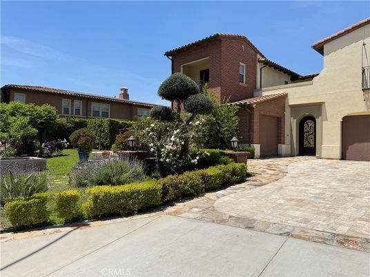 Attached, Backyard, Exterior, Facade, Brick Facade, Mediterranean