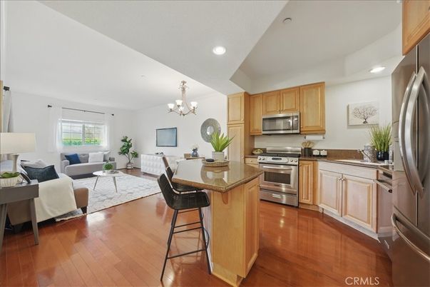 Chandelier, Dining room, Interior, Kitchen, Living room, Recessed Lighting, Stainless Steel Appliances, Wood Texture Flooring