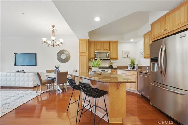 Chandelier, Dining room, Interior, Kitchen, Recessed Lighting, Stainless Steel Appliances, Wood Texture Flooring