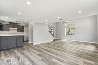 Chandelier, Empty room, Interior, Kitchen, Recessed Lighting, Stainless Steel Appliances, Wood Texture Flooring