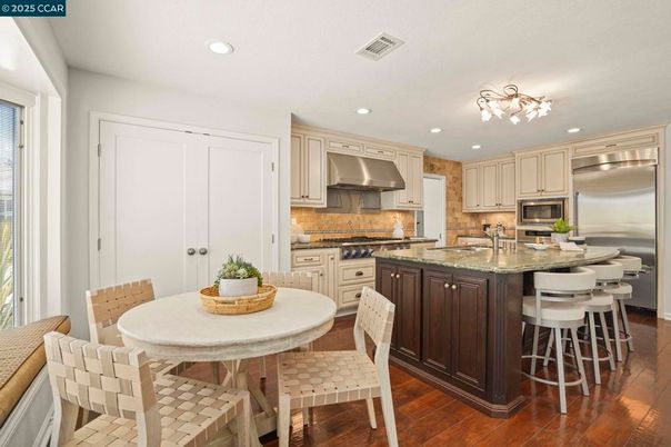 Dining room, Interior, Kitchen, Recessed Lighting, Stainless Steel Appliances, Wood Texture Flooring