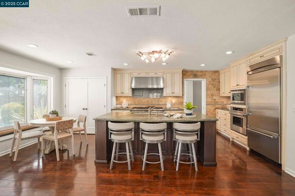 Dining room, Interior, Kitchen, Recessed Lighting, Stainless Steel Appliances, Wood Texture Flooring
