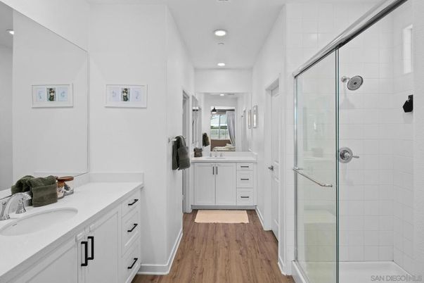 Bathroom, Dual Sink Vanities, Glass Shower, Interior, Recessed Lighting, Wood Texture Flooring