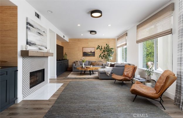 Fireplace, Interior, Living room, Recessed Lighting, Stone Walls, Wood Texture Flooring