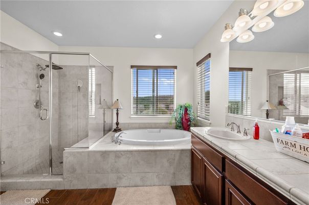 Bathroom, Dual Sink Vanities, Glass Shower, Interior, Recessed Lighting, Tile Countertops, Wood Texture Flooring