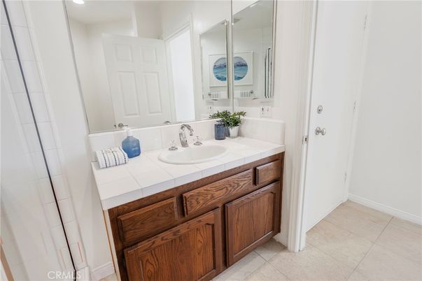 Bathroom, Dual Sink Vanities, Interior, Recessed Lighting, Tile Countertops
