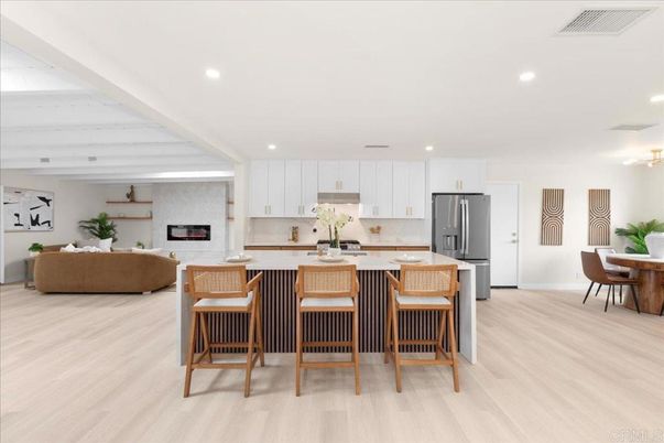 Dining room, Fireplace, Interior, Kitchen, Living room, Recessed Lighting, Stainless Steel Appliances, Wood Texture Flooring