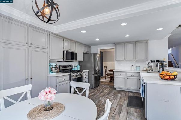 Dining room, Interior, Kitchen, Recessed Lighting, Stainless Steel Appliances, Wood Texture Flooring