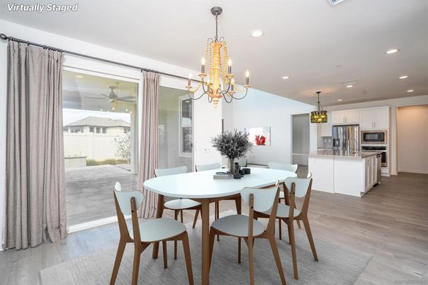 Chandelier, Dining room, Interior, Kitchen, Pendant Lights, Recessed Lighting, Stainless Steel Appliances, Wood Texture Flooring