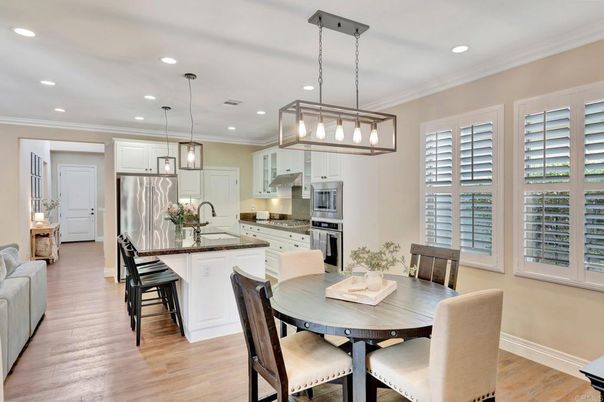 Dining room, Interior, Kitchen, Pendant Lights, Recessed Lighting, Stainless Steel Appliances, Wood Texture Flooring
