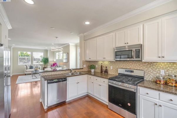Dining room, Interior, Kitchen, Living room, Pendant Lights, Recessed Lighting, Stainless Steel Appliances, Wood Texture Flooring