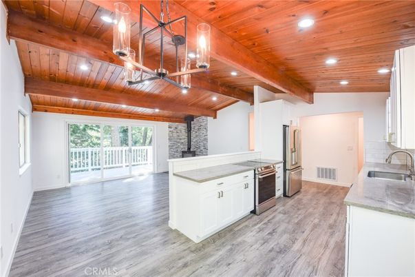 Fireplace, Interior, Kitchen, Recessed Lighting, Stainless Steel Appliances, Stone Walls, Wooden Beams, Wooden Ceilings, Wood Texture Flooring