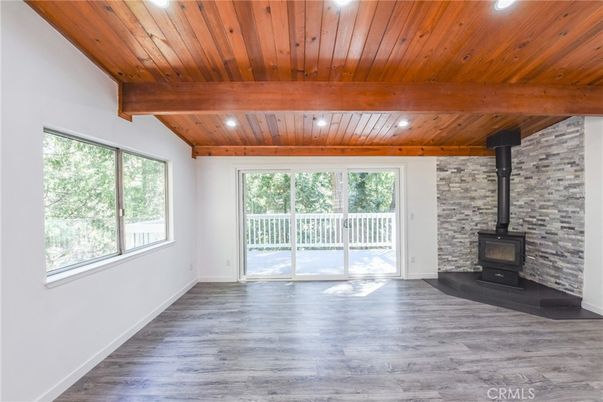 Empty room, Fireplace, Interior, Recessed Lighting, Stone Walls, Wooden Beams, Wooden Ceilings, Wood Texture Flooring