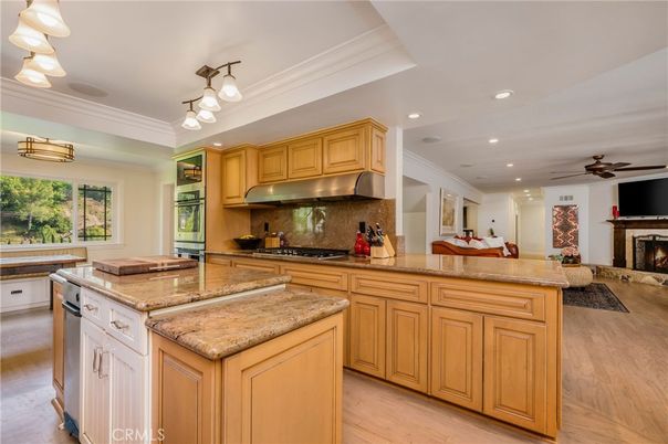 Fireplace, Interior, Kitchen, Recessed Lighting, Stainless Steel Appliances, Wood Texture Flooring