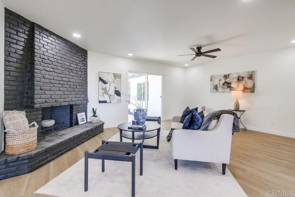 Fireplace, Interior, Living room, Recessed Lighting, Stone Walls, Wood Texture Flooring