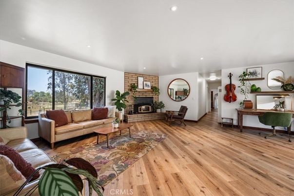 Fireplace, Interior, Living room, Recessed Lighting, Stone Walls, Wood Texture Flooring