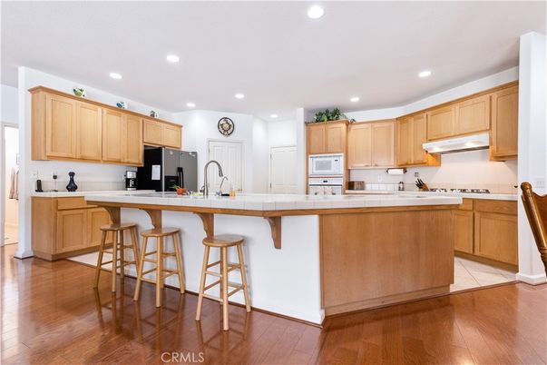 Interior, Kitchen, Recessed Lighting, Tile Countertops, Wood Texture Flooring