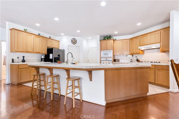 Interior, Kitchen, Recessed Lighting, Tile Countertops, Wood Texture Flooring