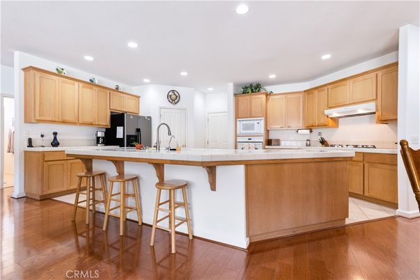 Interior, Kitchen, Recessed Lighting, Tile Countertops, Wood Texture Flooring