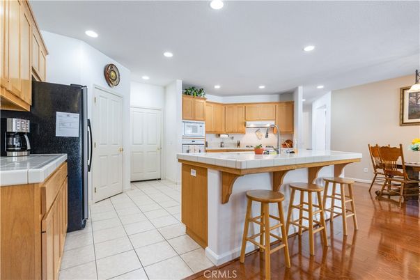 Interior, Kitchen, Recessed Lighting, Tile Countertops, Wood Texture Flooring