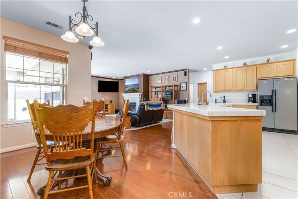 Dining room, Interior, Kitchen, Living room, Recessed Lighting, Tile Countertops, Wood Texture Flooring